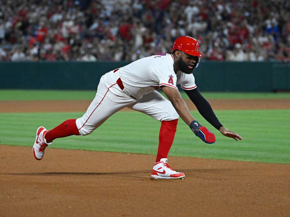 ANAHEIM, CA - JUNE 29: Los Angeles Angels right fielder Jo Adell (7) dives safely towards third base during an MLB baseball game against the Detroit Tigers played on June 29, 2024 at Angel Stadium in Anaheim, CA. (Photo by John Cordes/Icon Sportswire)