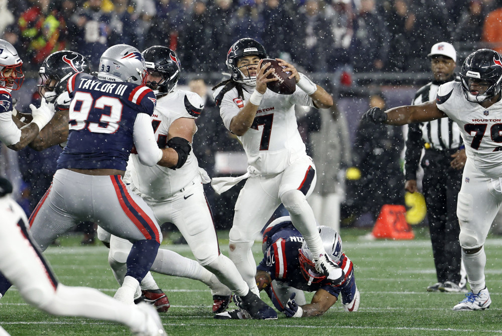 FOXBOROUGH, MA - JANUARY 18: C.J. Stroud #7 of the Houston Texans scrambles from trouble during an AFC Divisional Round game between the New England Patriots and the Houston Texans on January 18, 2026, at Gillette Stadium in Foxborough, Massachusetts. (Photo by Fred Kfoury III/Icon Sportswire)
